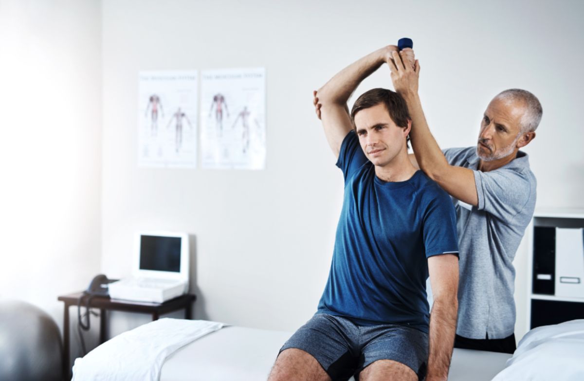 a doctor helping a patient 